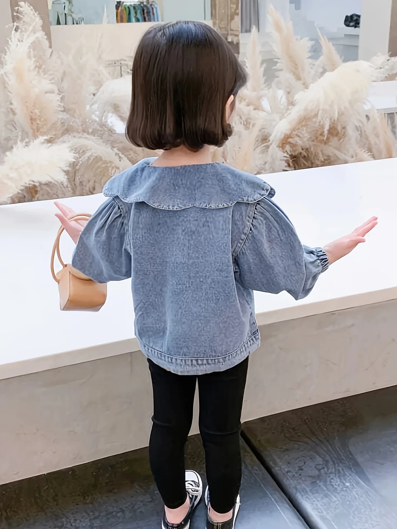 Girls' knit cardigan in blue, front view